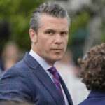 Defense Secretary Pete Hegseth arrives on the South Lawn of the White House before President Donald Trump and first lady Melania Trump participate in the White House Easter Egg Roll Monday, April 21, 2025, in Washington. (AP Photo/Alex Brandon)