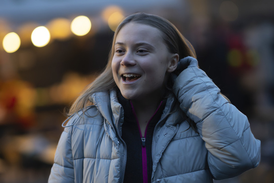 Climate activist Greta Thunberg dances after addressing tens of thousands of people who marched through Amsterdam, Netherlands, Sunday, Nov. 12, 2023, to call for more action to tackle climate change. Thunberg was among the speakers at the march that comes 10 days before national elections in the Netherlands. (AP Photo/Peter Dejong)
